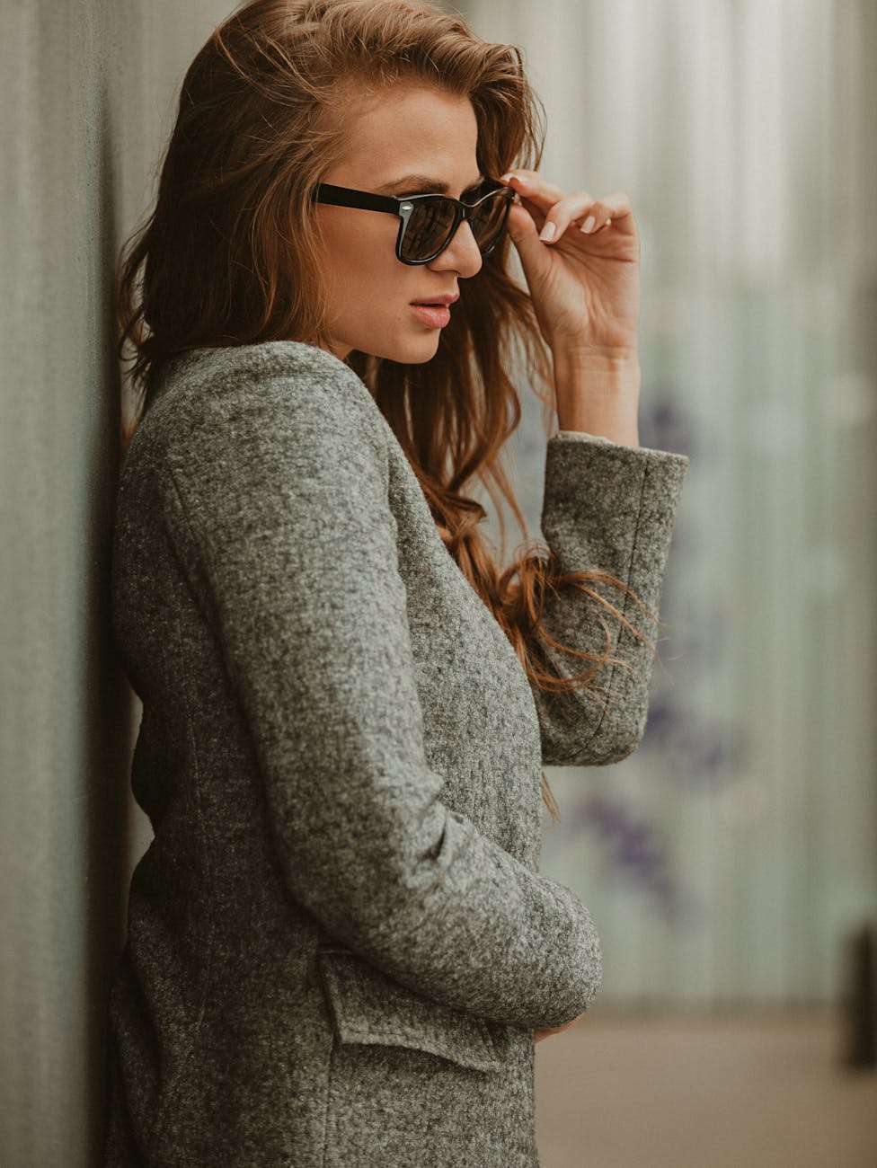 Woman in Gray Coat and Sunglasses